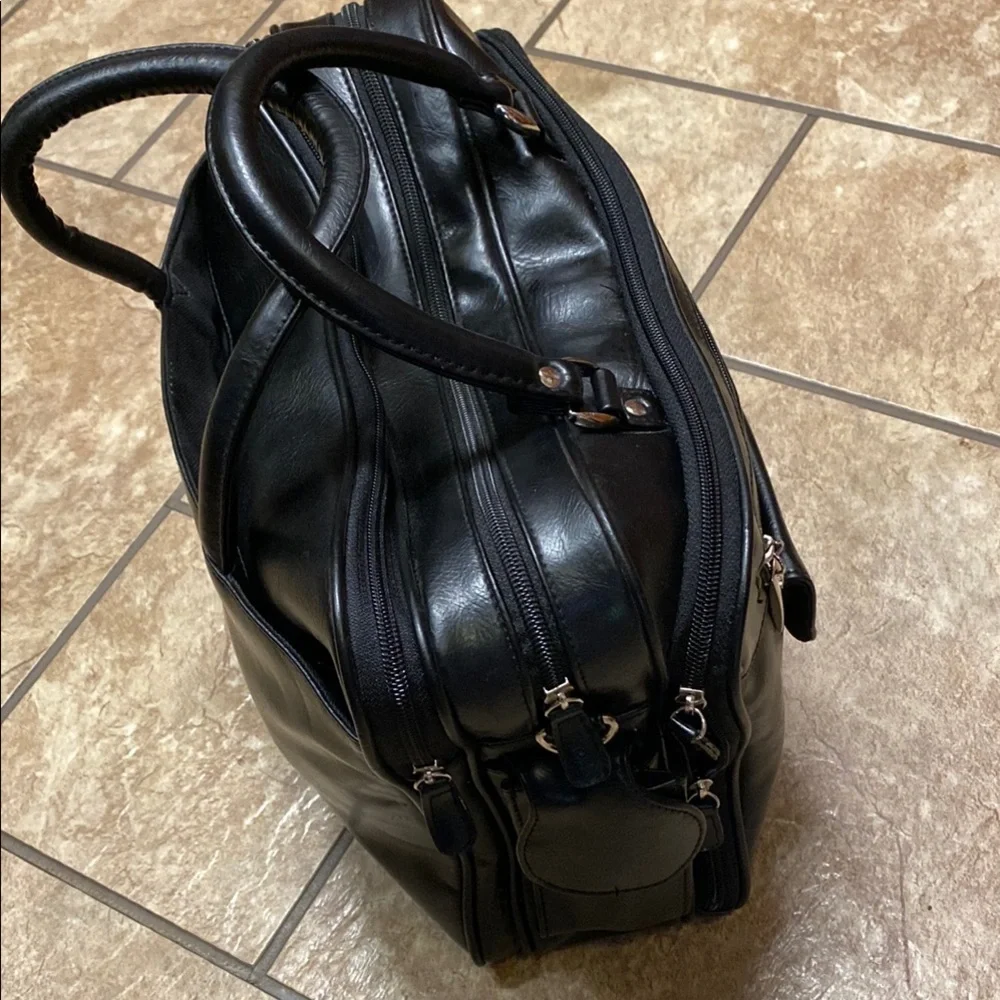 Black Duffel Bag with Structured Design and Smooth Vinyl Practical Utility